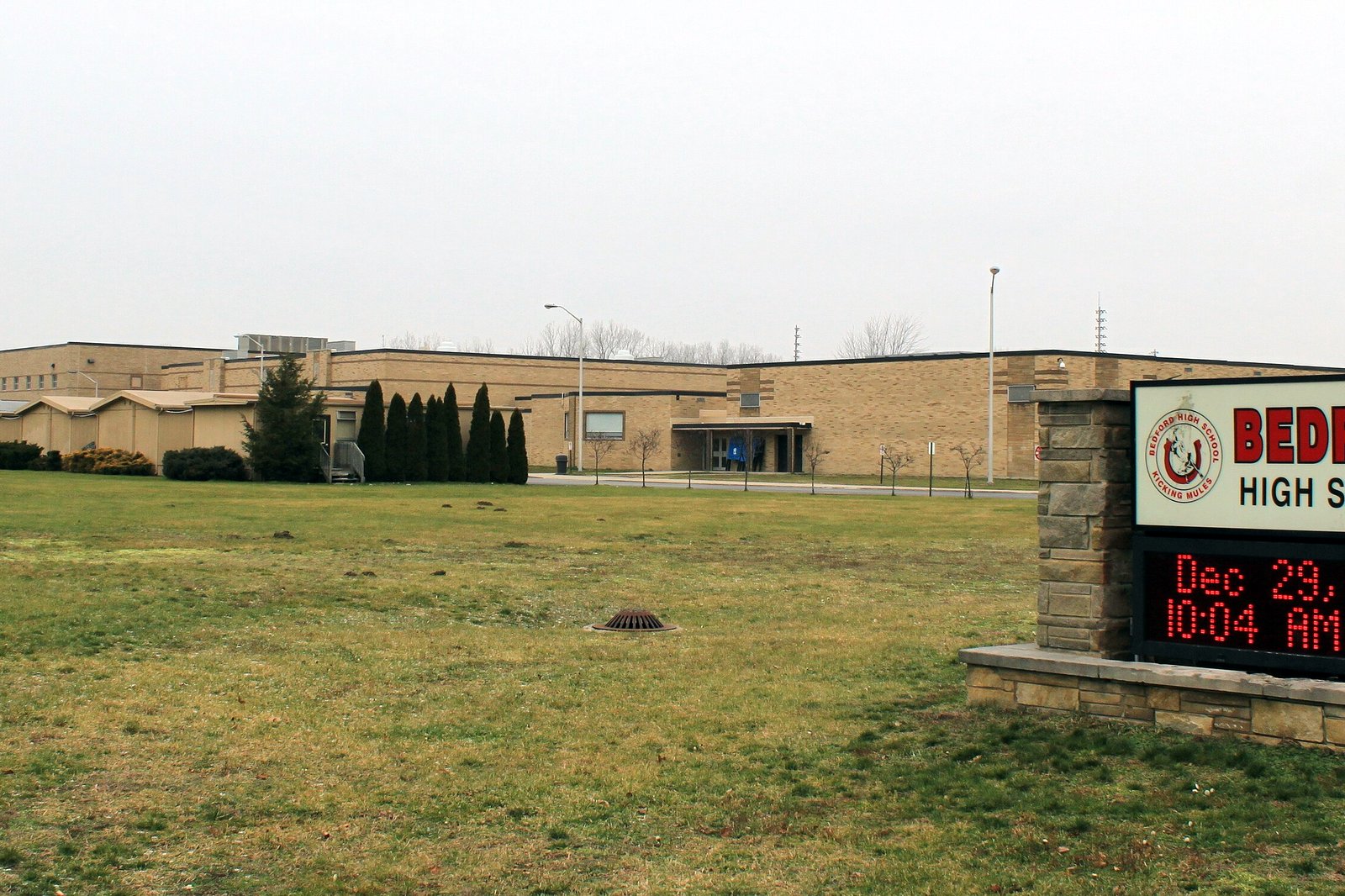 Exterior of Bedford High School in Temperance, Michigan, a brick school building with parking in front.