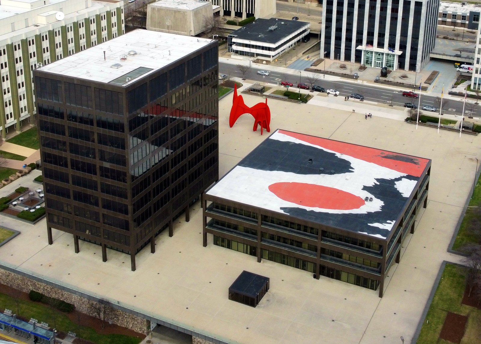 Aerial view of Calder Plaza in downtown Grand Rapids, with the red La Grande Vitesse sculpture, the dark Grand Rapids City Hall tower and the Kent County administration building.