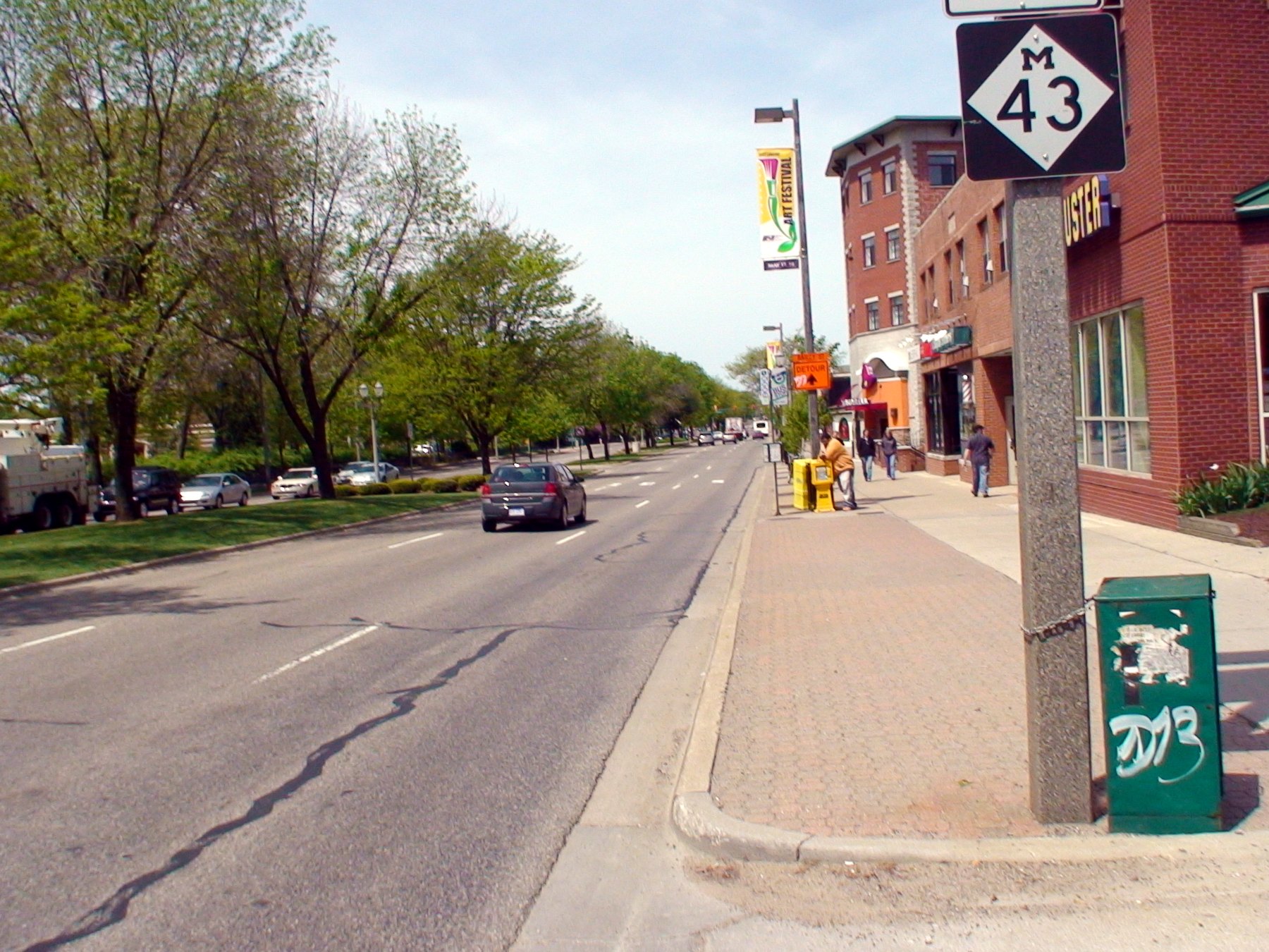 Grand River Avenue at Collingwood Drive in East Lansing, with the M-43 route marker on the sidewalk.