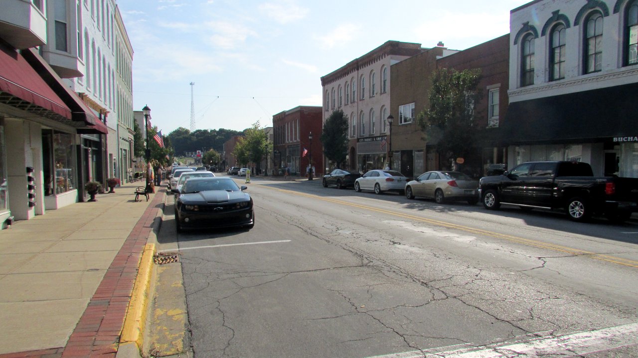 Storefronts and parked cars along Front Street in downtown Buchanan, Michigan, on a September morning in 2019.